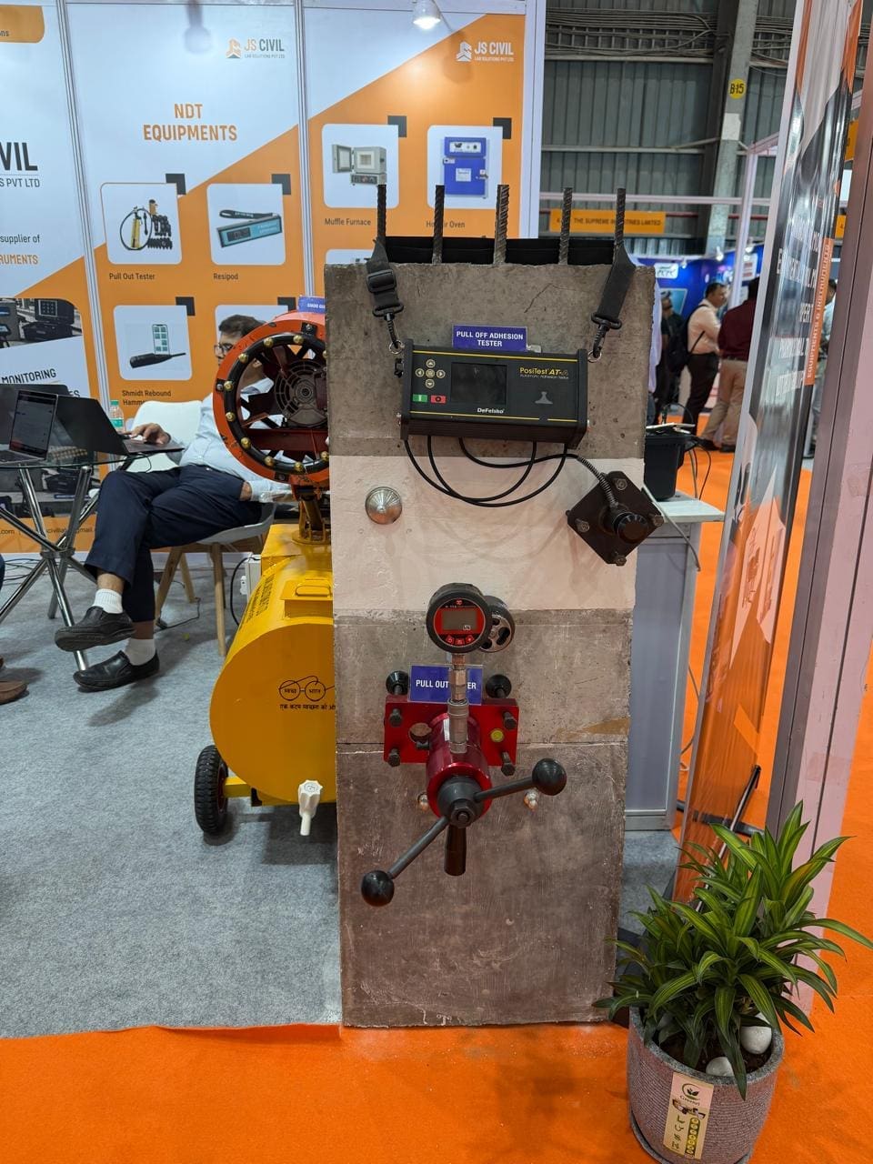 Global Lab team demonstrating GalvaPulse corrosion mapping system at World of Concrete India 2026